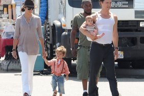 Matthew McConaughey, white tank top, black dress pants, Camila Alves, white pants, brown fedora, beige shirt, bracelets